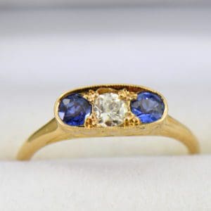 Kendra s Nouveau Sapphire Diamond Yellow Gold 3 stone ring.JPG