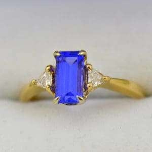 Petite Emerald Cut Tanzanite Trillion Diamond Yellow Gold Ring.JPG