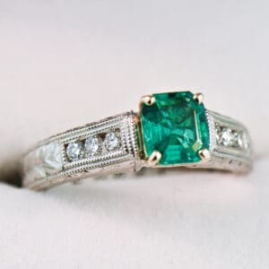 colombian emerald and diamond carved engagement ring