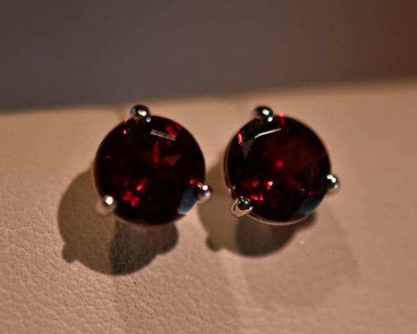 red garnet three prong martini stud earrings