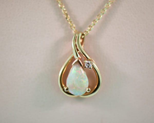 modern estate white pear shaped opal and diamond pendant