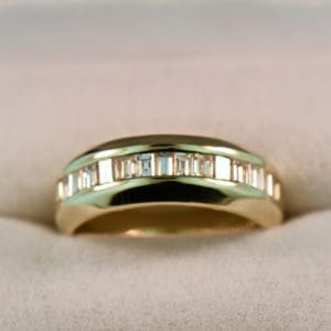 channel set baguette diamond wide gold wedding band