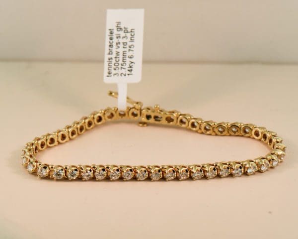 extra fine yellow gold and diamond three prong tennis bracelet 3