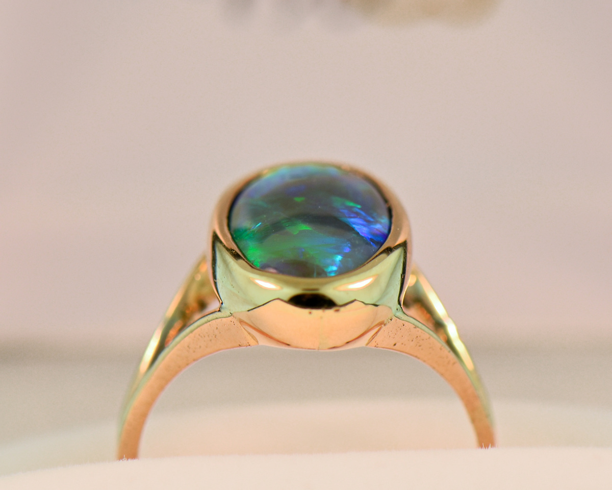Black Crystal Opal Solitaire Ring in Yellow Gold Bezel
