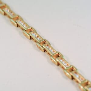 channel set yellow gold and 2ct diamond tennis bracelet