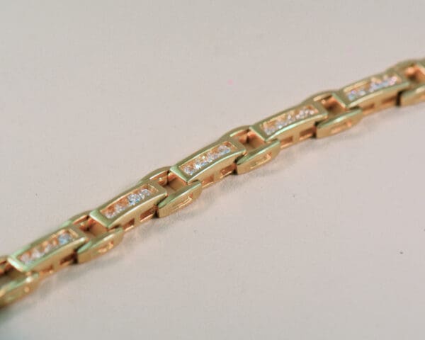 channel set yellow gold and 2ct diamond tennis bracelet 3