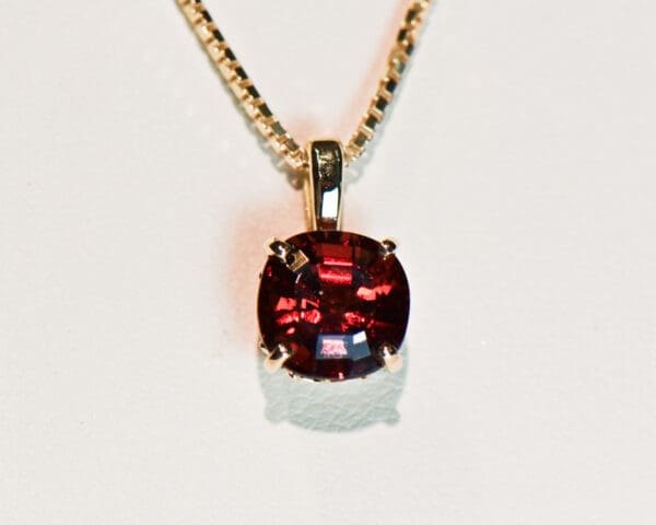 cushion cut red garnet solitaire pendant in gold 2