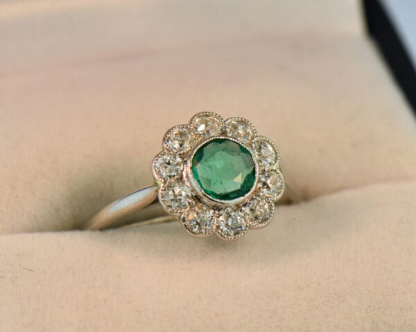 art deco platinum emerald diamond flower halo ring