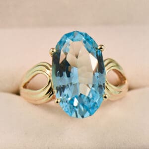 custom cut oval swiss blue topaz cocktail ring