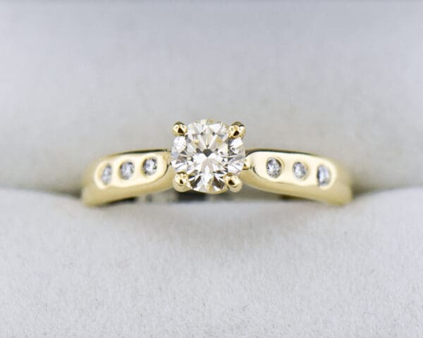 natural diamond engagement ring in classic yellow gold setting