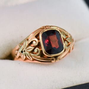 nouveau rose gold and garnet carved floral band ring