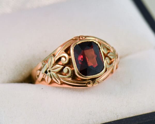 nouveau rose gold and garnet carved floral band ring