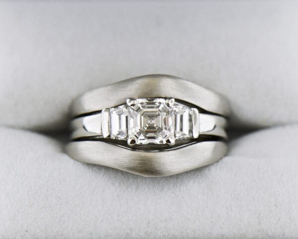 platinum wedding set with asscher cut diamond trapezoid accents and framing bands