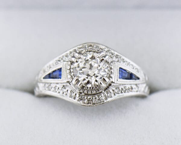 vintage style ring with old european cut diamond center and sapphire accents 2