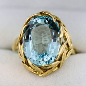 mid century aquamarine cocktail ring with floral gold mounting