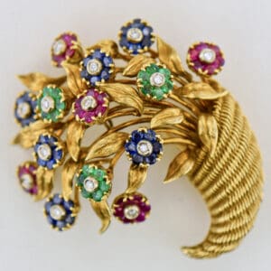 vintage Tiffany and Co cornucopia brooch with gemstone flowers en tremblant