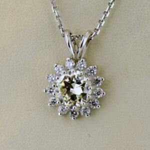 old euro cut fancy light yellow diamond halo pendant