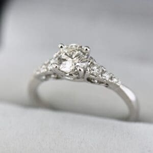 classic diamond engagement ring with .70ct natural vs diamond center