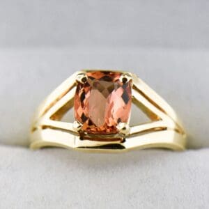 cushion peach pink imperial topaz and gold split shank solitaire ring