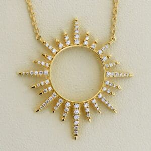 custom 18k gold and diamond sunburst pendant with diamond station chain