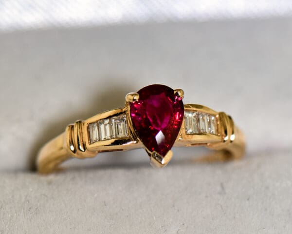 modern estate pear shape ruby ring with baguette diamond accents 4