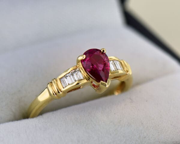 modern estate pear shape ruby ring with baguette diamond accents 5