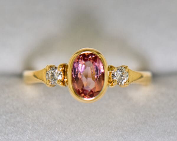 bezel set pink imperial topaz and diamond 3 stone ring 3