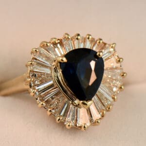 dark blue pear shape sapphire and baguette diamond ballerina ring