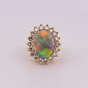 huge yellow gold opal and diamond halo cocktail ring