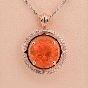 large round mexican fire opal and diamond pendant rose and white gold