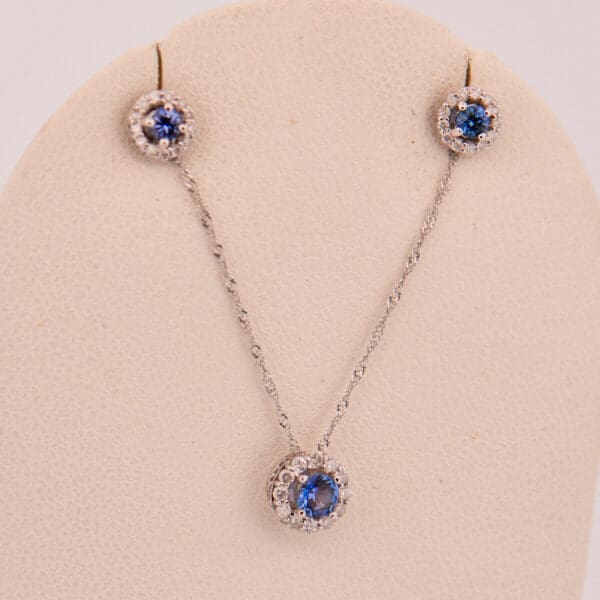 montana blue yogo sapphire and diamond halo pendant and earring set 4