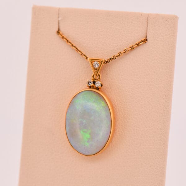 vintage bezel set yellow gold crystal opal and diamond pendant