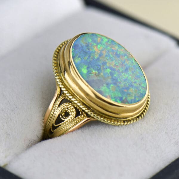 vintage ring with boulder opal bezel set with rope accents 2