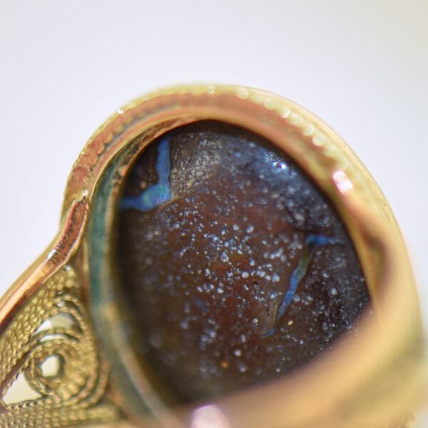 vintage ring with boulder opal bezel set with rope accents 3