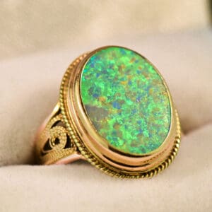 vintage ring with boulder opal bezel set with rope accents