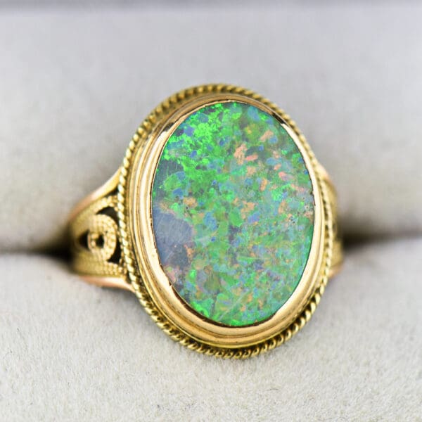 vintage ring with boulder opal bezel set with rope accents 4