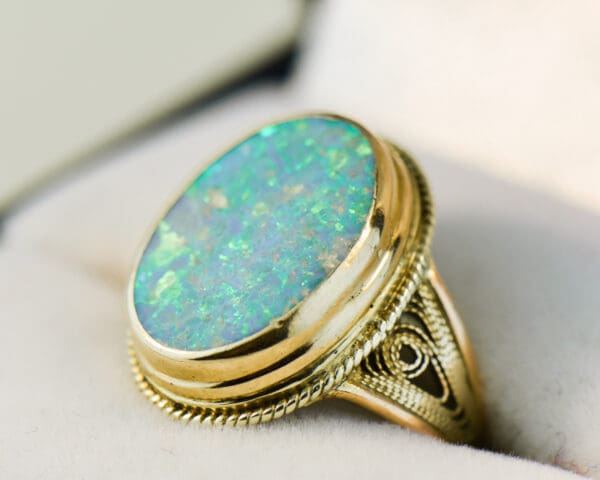 vintage ring with boulder opal bezel set with rope accents 5