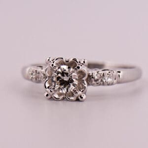 vintage white gold and diamond engagement ring with buttercup illusion setting