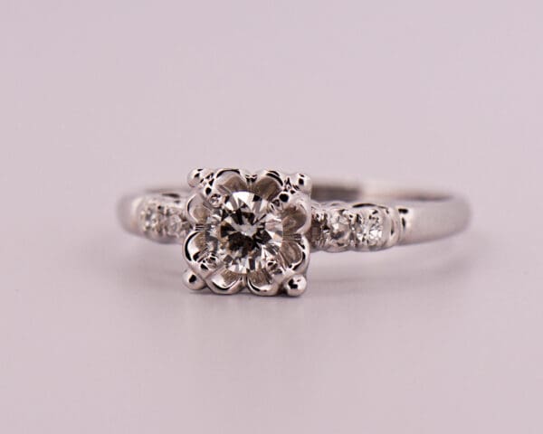 vintage white gold and diamond engagement ring with buttercup illusion setting