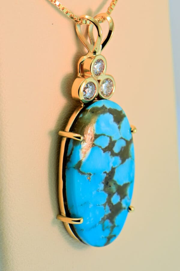 large kingman turquoise and diamond pendant set in yellow gold 2