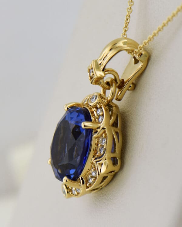 yellow gold pendant set with deep color natural tanzanite and diamonds 2