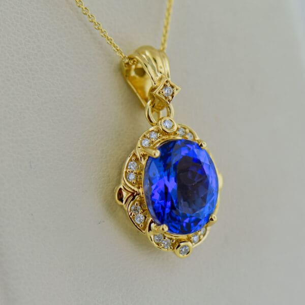 yellow gold pendant set with deep color natural tanzanite and diamonds 3