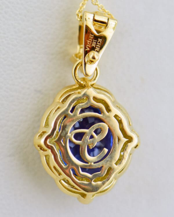 yellow gold pendant set with deep color natural tanzanite and diamonds 4