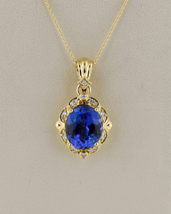 yellow gold pendant set with deep color natural tanzanite and diamonds 5