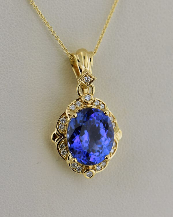 yellow gold pendant set with deep color natural tanzanite and diamonds